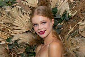 Closeup portrait of young beautiful woman with a healthy skin of the face. photo