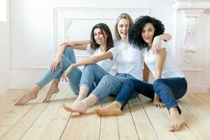 three girlfriends having a talk at home photo