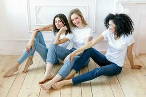 three girlfriends having a talk at home photo