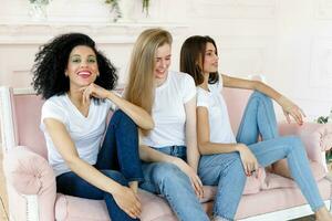 three girlfriends having a talk at home photo