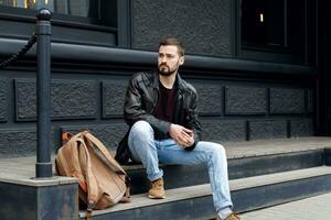 Fashionable man posing in old city photo