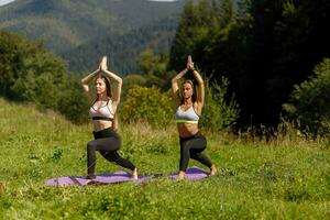 Fitness women in triangle pose while practising yoga at a park. photo