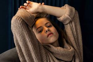 little girl in brown sweater photo