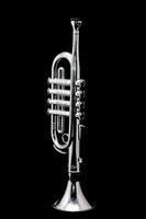 a silver trumpet on a black background photo