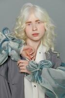 beautiful albino girl with white skin, natural lips and white hair photo