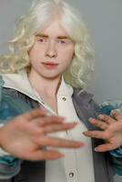 beautiful albino girl with white skin, natural lips and white hair photo