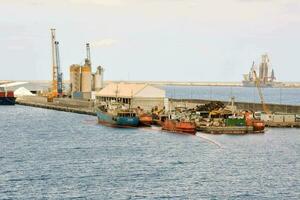a large dock with several boats docked in it photo