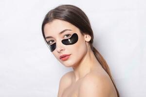 Eye black patch, Beautiful Woman With Natural Makeup photo