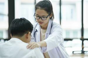 Kind doctor offering a loving gesture to a sick person during a health crisis. photo