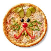 Kids pizza with ham, mozzarella and funny rabbit muzzle of cherry tomato, bell pepper, olives, arugula and pickled cucumber photo