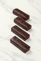 Chocolate bars without sugar stuffed with dried fruits and nuts photo