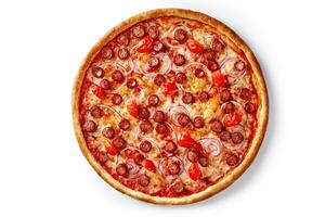 Thin pizza with hunting sausage, tomatoes and purple onions isolated on white background photo