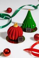 Pastries in shape of red Christmas ball and green tree photo