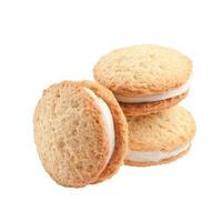 Butter shortbread sandwich biscuits with mascarpone cream filling on white background photo