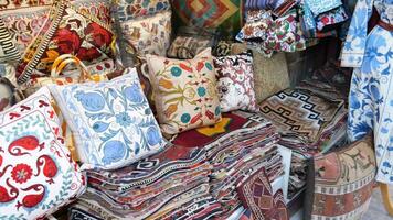 Colourful cushions on display for sale in a traditional Turkish Bazaar. video