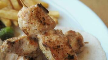 Chicken skewers with french fries and rice video