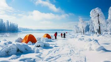 Ice fishing enthusiasts bravely piercing through thick idyllic remote frozen lake photo