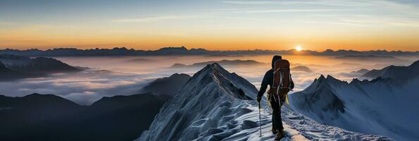 Silhouetted climber on icy ridge at twilight background with empty space for text photo