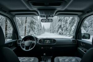 Crisp winter forest seen from vans interior background with empty space for text photo