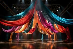 Breathtaking aerial silk display encircled by a carnival of colorful circus props photo