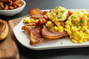 fried bacon and scrambled eggs. AI Generative Pro Photo