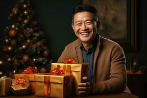 Man expressing joy while unwrapping festive gift isolated on a gradient background photo