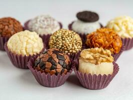 Chocolate truffles on a white background, close-up photo