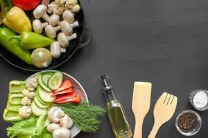 Top view of a fresh vegetables for healthy nutrition. Black background with copyspace. photo