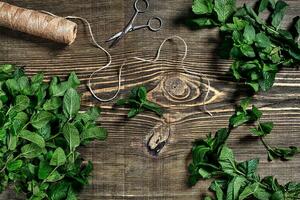 Fresh mint leaves on wooden background. Top view. Copy space photo