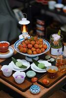 Litchi fruits in a bowl on a table in a restaurant photo