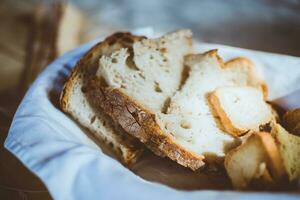 Slices of bread in a basket on the table. Selective focus. photo