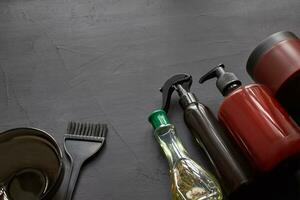 Top view of a professional hairdresser kit with copy space on a black background. photo