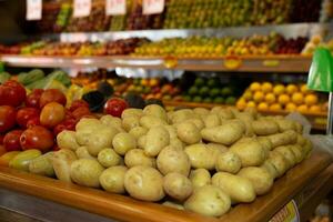 Potatoes and other vegetables on a market stall in the Netherlands. photo