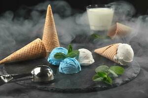 Close-up shot of a creamy and blueberry ice cream served on a dark slate, black background. photo