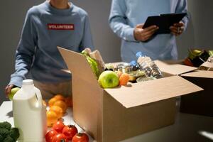 Close-up of delivery man delivering food box to customer at home photo