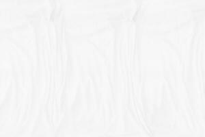 Top view Abstract White cloth background with soft waves.Wave and curve overlapping with different shadow of color,white fabric, crumpled fabric. photo