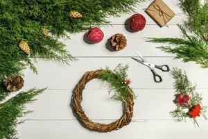 How to make christmas door wreath. The working process. The decorator's workplace. Top view photo