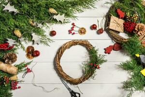 How to make christmas door wreath. The working process. The decorator's workplace. Top view photo