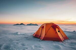 Tent pitched on icy summit at dusk background with empty space for text photo