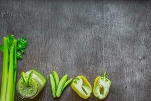 Green vegetable smoothie with celery and cucumber photo