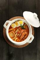 Curry Laksa which is a popular traditional spicy noodle or udon soup from the culture in Malaysia photo