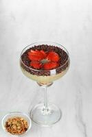 ice cream with chocolate and strawberries on a white background photo