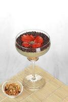 ice cream with chocolate and strawberries on a white background photo