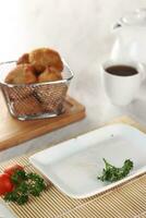 fried potato cheese balls croquettes with tomato ketchup served in a basket. white background and garnish photo