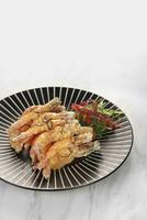 flour fried shrimp with salted egg on a plate photo
