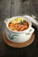 Curry Laksa which is a popular traditional spicy noodle or udon soup from the culture in Malaysia photo