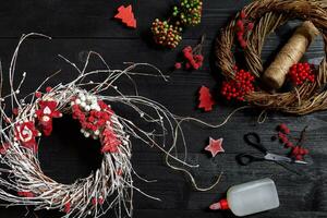 Make a Christmas wreath with your own hands. Workplace for preparing handmade decorations. photo