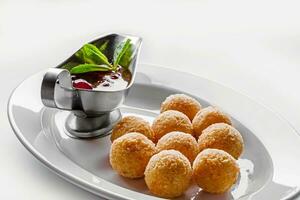 Deep fried cheese balls for buffet dinner. Catering food for gala dinner or event. photo