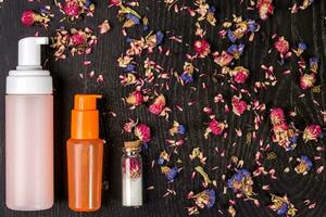 Petals, dry flowers and women's accessories. Flat lay, Top view photo