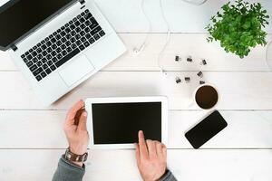 Directly above view of human hands typing on laptop. photo